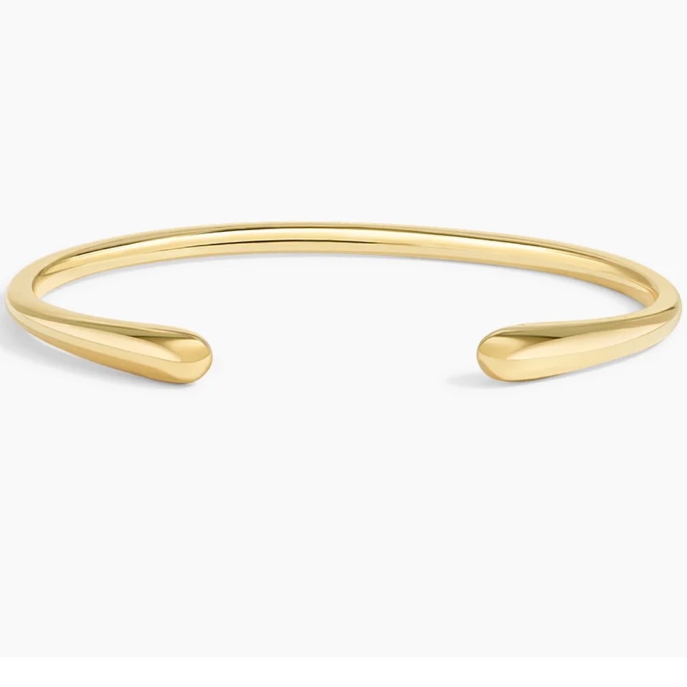 Gold-colored open-ended minimalist cuff bracelet